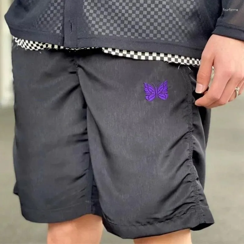 Herrshorts 2023SS svarta nålar nylon män kvinnor lila fjäril logotyp high street mesh awge byxor