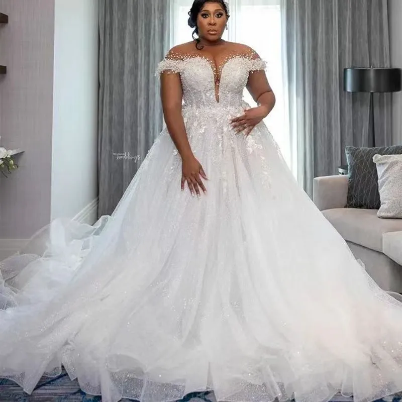 Abito da sposa di lusso per la sposa 2024 Collo trasparente Con lacci sul retro Perline principali Paillettes Perle Plus Size Donna Africa Abiti da sposa Abiti da sposa