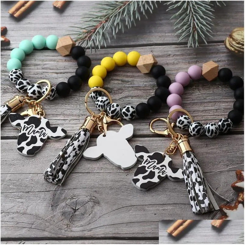 Autres fournitures de fête de fête Sile Cursive Cow Bead Bracelet Bois Disque Porte-clés Gland Ox Tête Poignet Porte-clés Charme Pendentif Accesso Dh7Wd