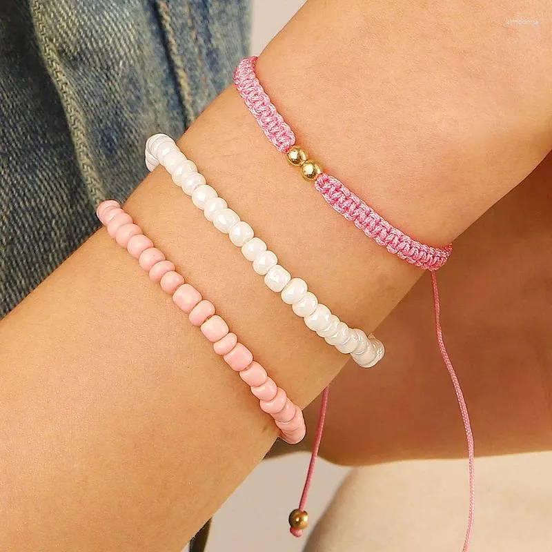 Braccialetti con ciondoli Set di braccialetti con perline di riso eleganti imitazione perla Boho per donne Gioielli da sposa di moda regolabili con corda intrecciata rosa carino