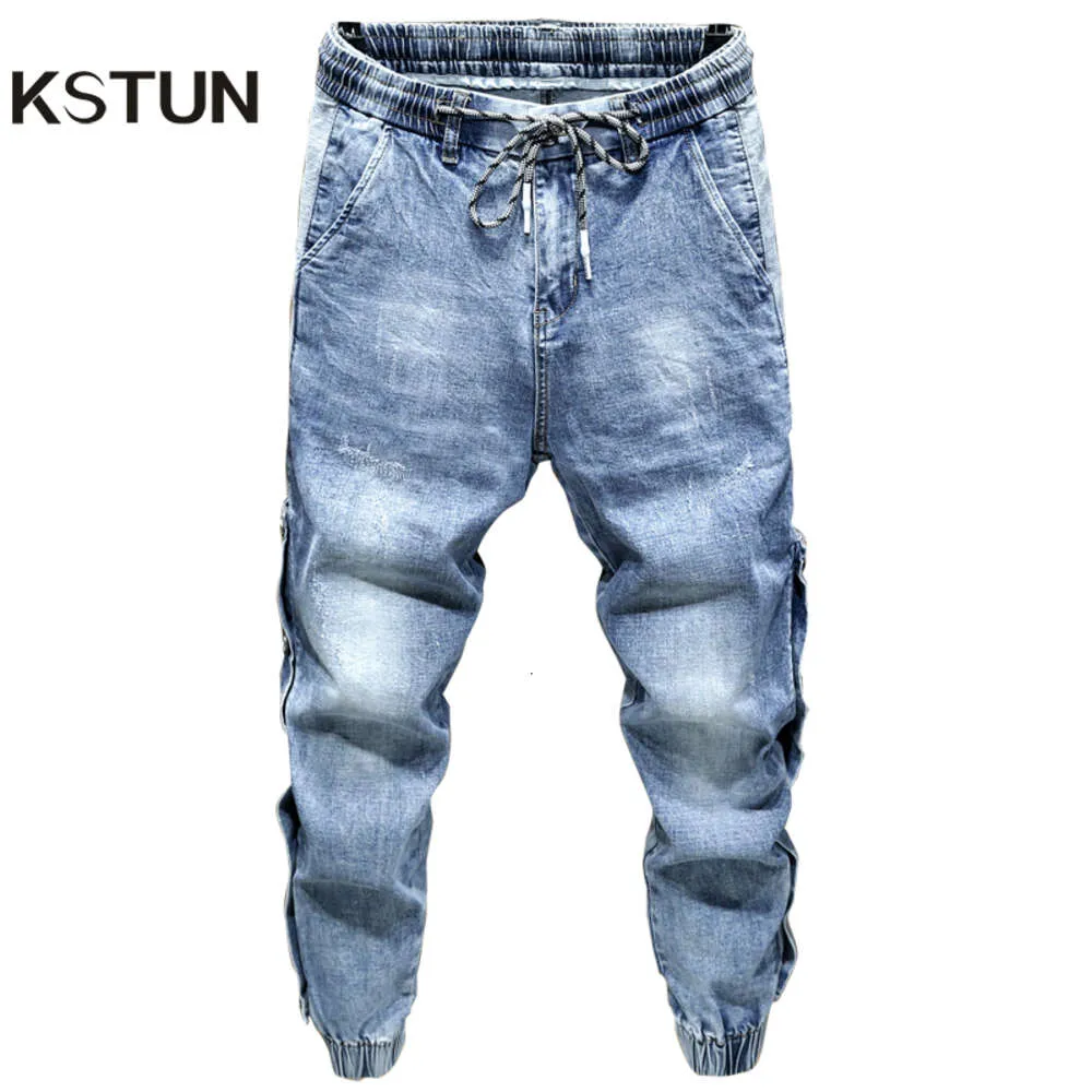 Överdimensionerade harembyxor bred ben lös passform avsmalnande jeans manliga joggar hip hop streetwear elastiska midja byxor för män