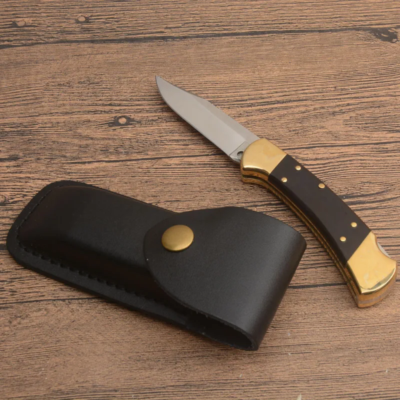 Precio de fábrica Classic 112 AUTO Cuchillo plegable táctico 440C Hoja satinada Ébano / Mango de cabeza de latón EDC Navajas de bolsillo con funda de cuero Cuchillos de regalo