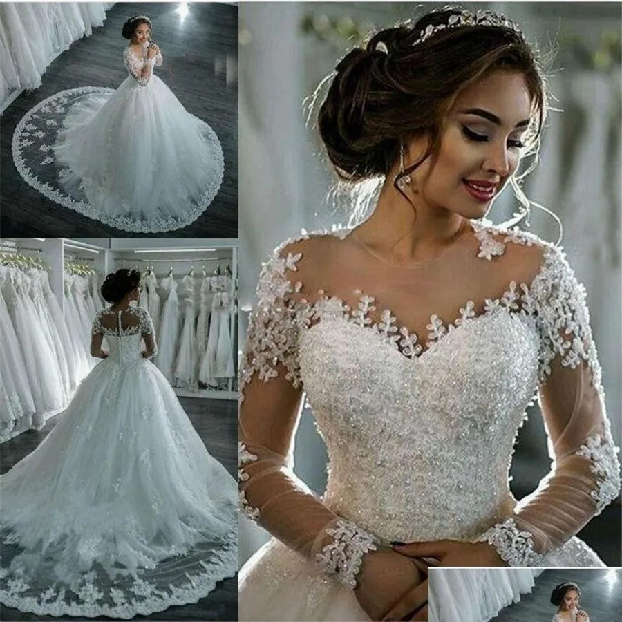 A linha de vestidos de casamento sexy ver através de manga longa marfim sheer bling frisado laço applique jóia pescoço vestidos de baile capela nupcial gota dhlvd