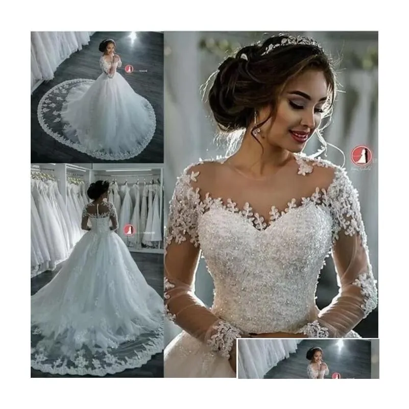 A-lijn Trouwjurken 2022 A-lijn Mode Dubai Elegant Lange Mouwen Sheer Ronde Hals Kant Appliques Kralen Vestios De Novia Bridal Dhtho