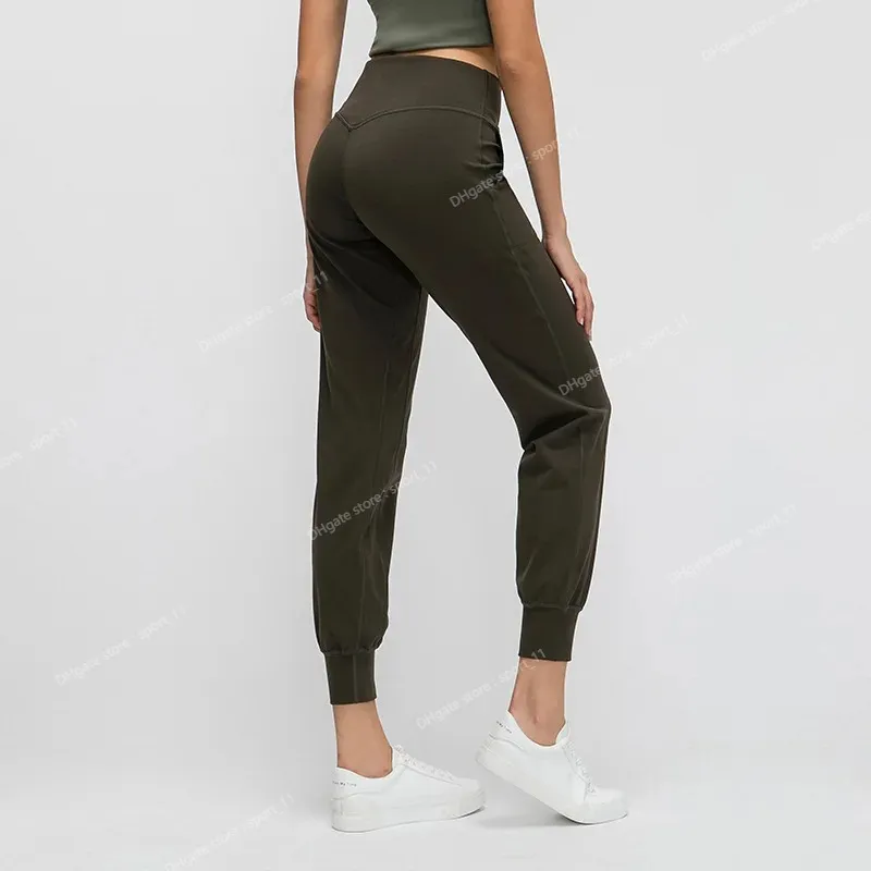 Femmes à forte nue en tissu lâche sport actif actif jogger de jogger élastique Leggings avec deux poches latérales pantalon yogayoga complet pantalon actif pantalon jogger pantalon