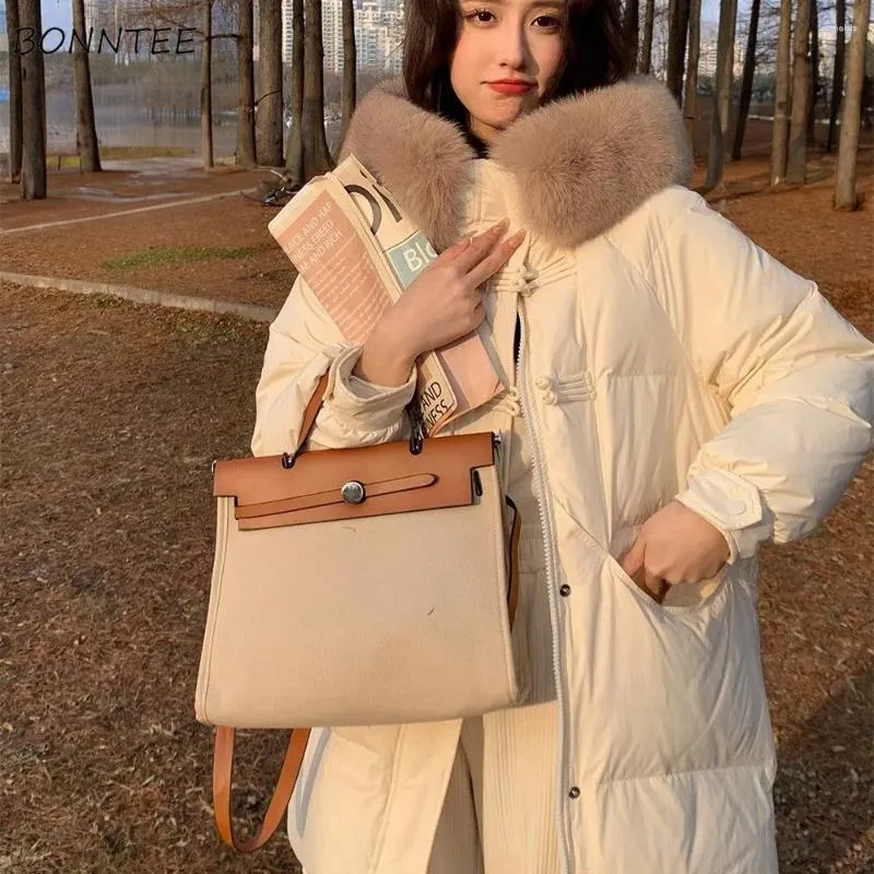 Korki damskie płaszcze średniego stylu parki dla kobiet z kapturem luźna moda 2023 Zima swobodna noszenie śniegu ciepła samica solidna