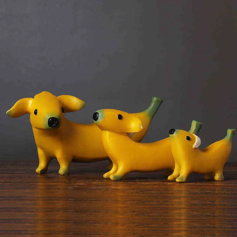Estatuetas decorativas de resina nórdica estátua escultura de cães de banana criativa animal fofo para cão de cão de crianças enfeites de bancada de bancada de bancada decoração de cães de banana