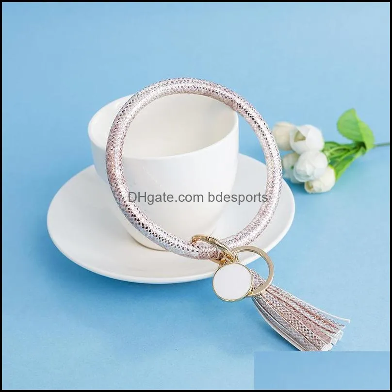 Favore di partito Pu Braccialetti avvolgenti in pelle Portachiavi Portachiavi Bracciale color arcobaleno Chiavi Anello Ciondoli nappa Braccialetti Fibbie Vendita 10 5Cha L1 D Dhf6R