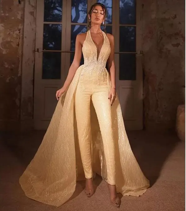 Champagne gouden trouwjurk jumpsuit met afneembare trein 2023 halter kanten appliqued glanzende bruidsjurk broekpak