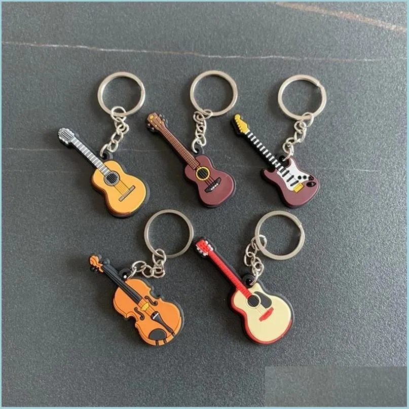 Keychains Creative Mini Musical Musical Instrument Keychain Cute Sile Guitar Piano Saxofone Chave Backpack Car Ornament Musician Jewelry DHPRF