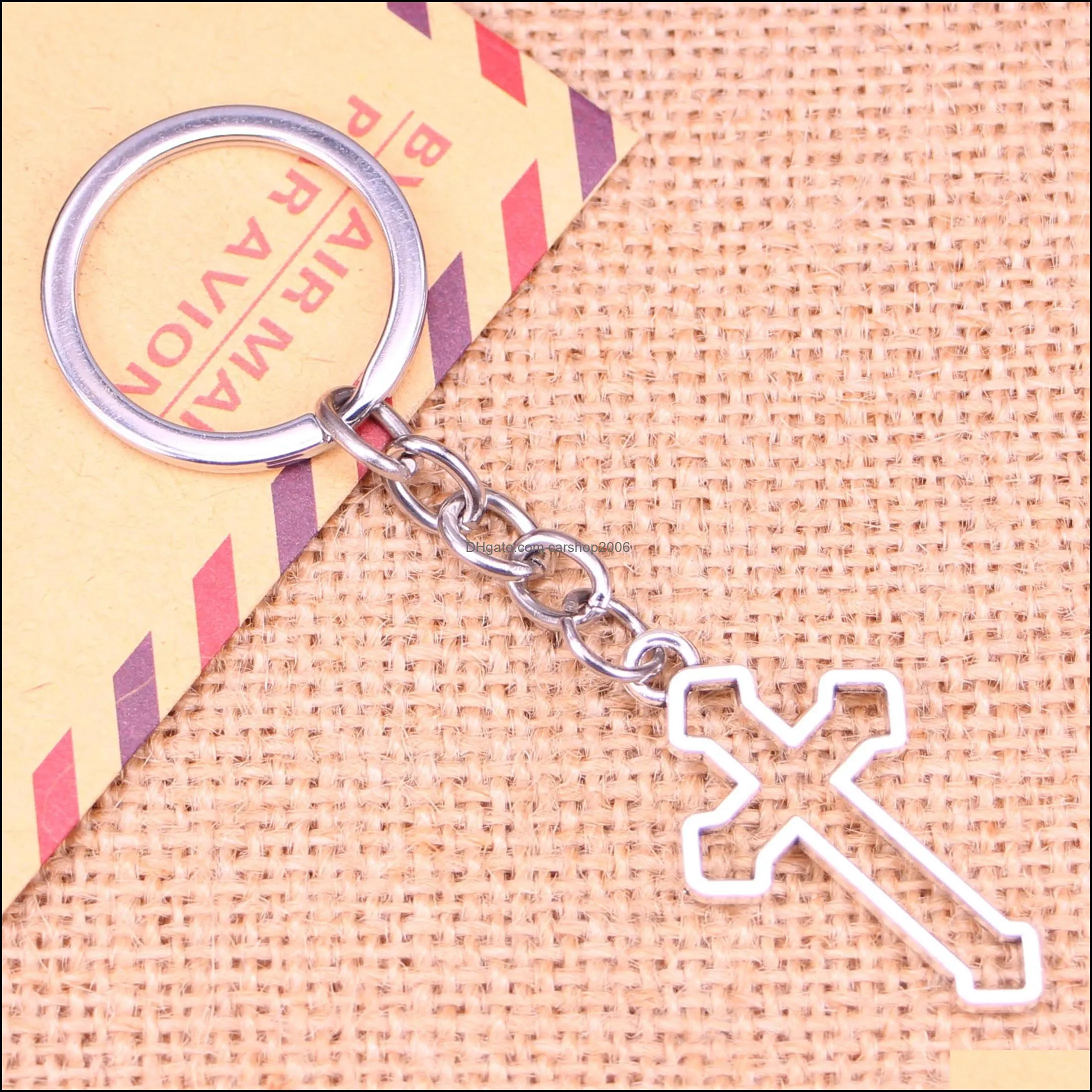 Key Rings 20Pcs New Fashion Keychain 38X22 Mm Hollow Cross Pendants Diy Men Jewelry Car Key Chain Ring Holder Souvenir For Gift Drop Dhxop