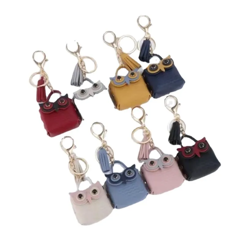 Porte-monnaie de dessin animé mignon PU Owl Design Porte-clés avec pompon Portable Mini Portefeuille Écouteurs Sacs de rangement Mode Porte-clés de voiture Sac Pendentif Gif 2063 E3