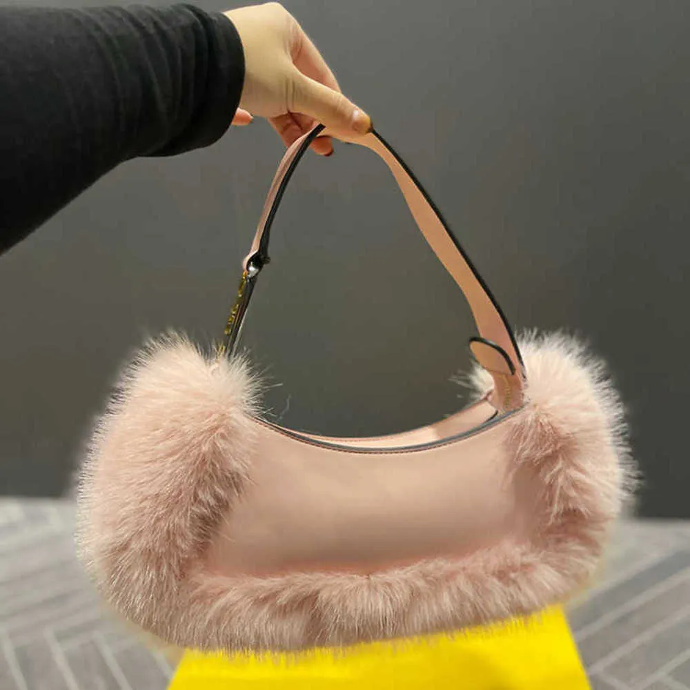 Designer väskor axel baguette väskor kvinna handväskor lyxiga sömmar pälsiga underarmsäckar eleganta söta plånböcker
