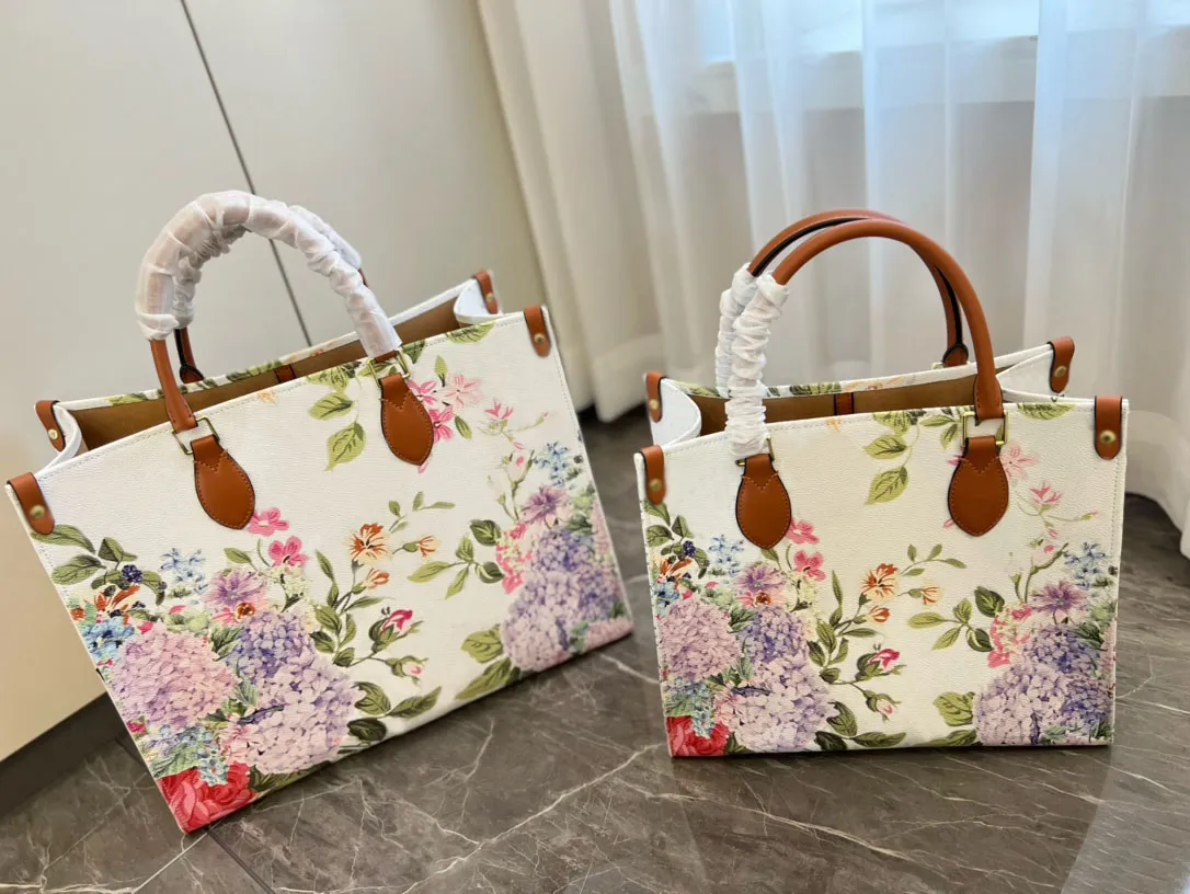 2023 Hot Designer Onthego Tote Bag Hights Hide Buybags Printing Flowers Flowers Empreinte Counter Leather PM MM GM on the Go Shopping Facs M21233
