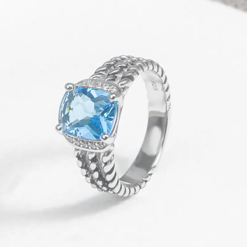 Klassischer Damenring mit eingelegtem blauem Topas und Zirkon, Retro-Ring mit gedrehtem Kabel