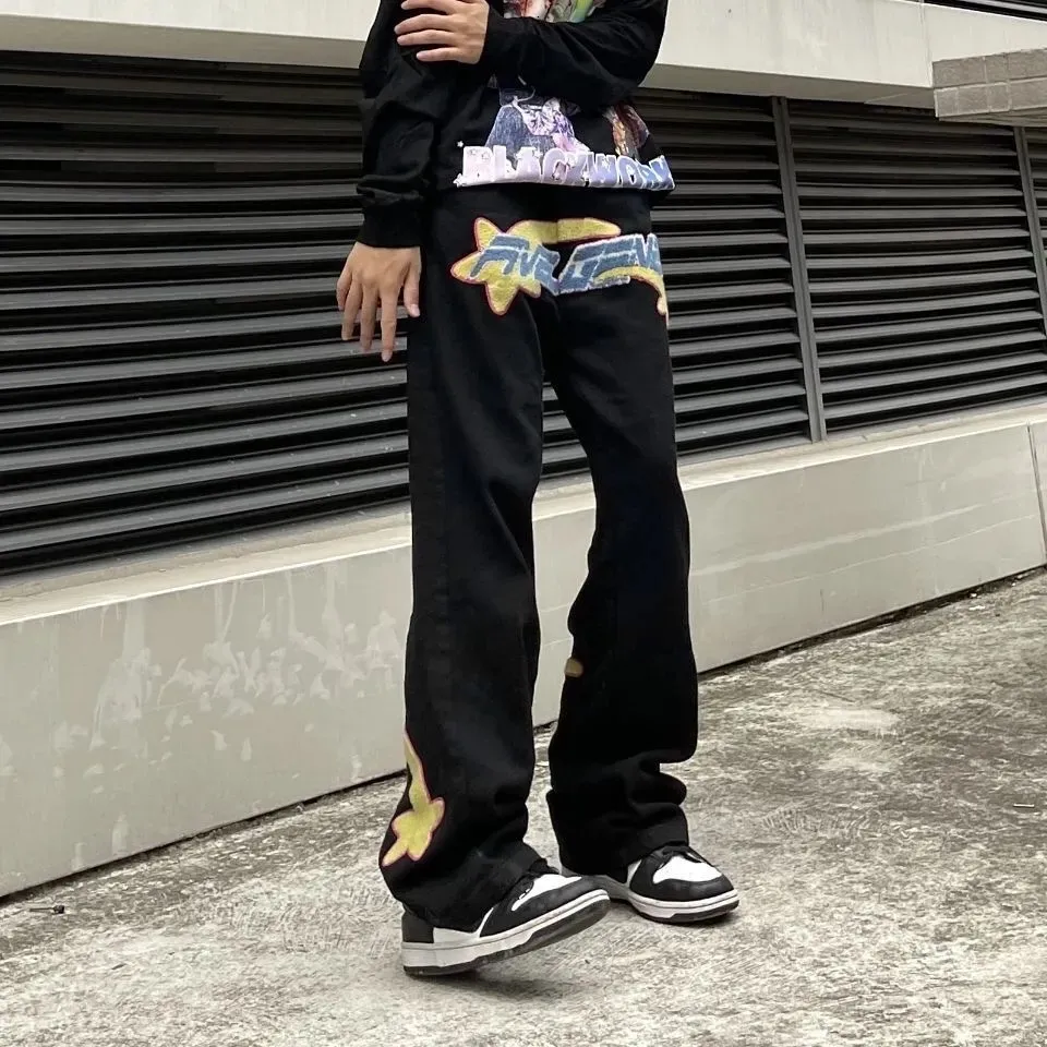 Jeans hotsell ricamati uomo