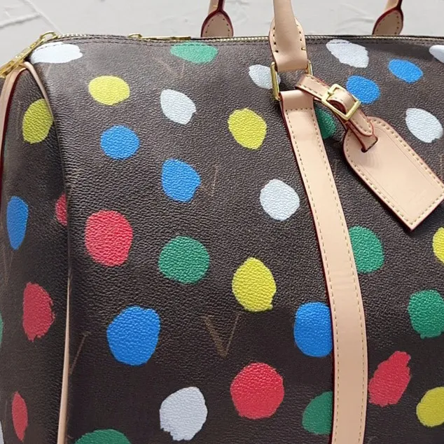 Designer plunjezakken voor mannen merk luxe reistas graffiti dames luxe designer tassen grote capaciteit echte lederen tas fashion291t