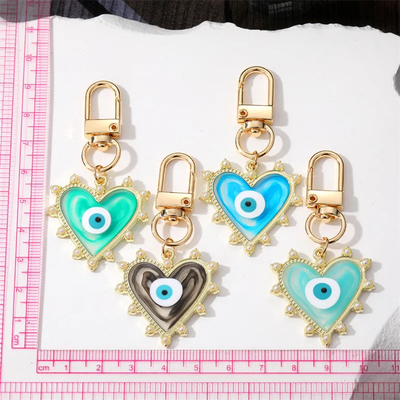 Candy Color Blooming Heart Evil Eye Clasp Nyckelringar för vänälskare Gift Harts Eye Bag Car Keyring Pendant Keychain