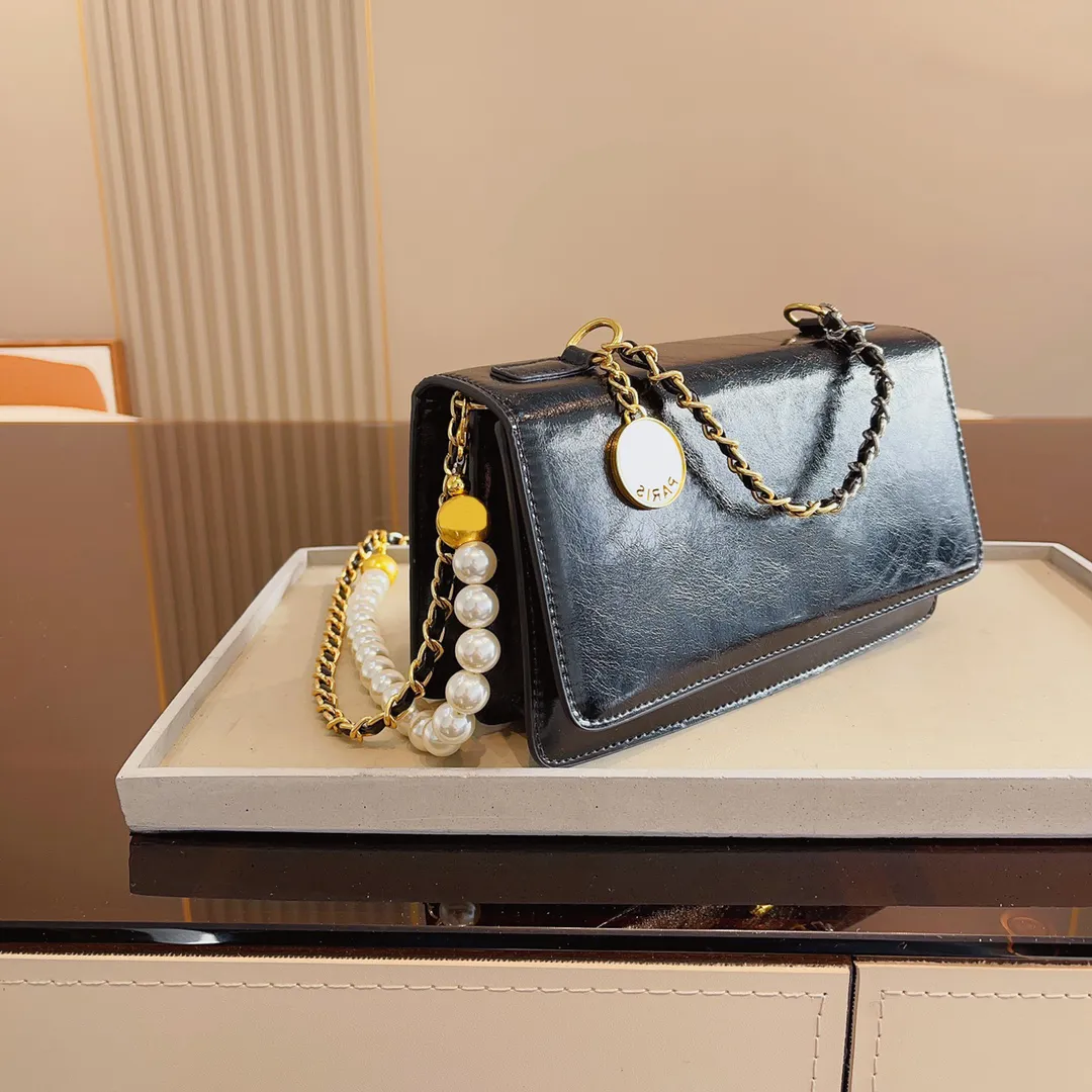 Bag designer axelväska lyxiga designers kvinnor kedja handväska crossbody väskor all-match mode koppling fast färg plånbok läder handväskor 231215
