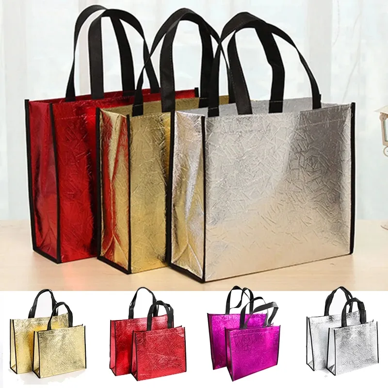Błyszcząca składana torba na zakupy wielokrotnie używa się dużych unisex laserowych torbów na ramię