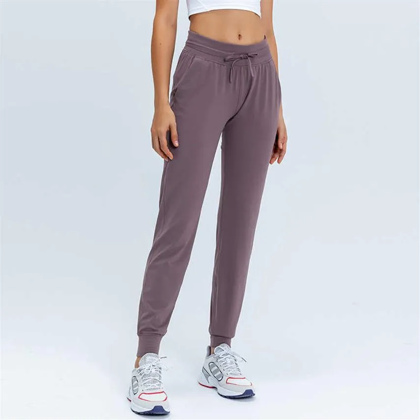 L-31 Pantalones de yoga para mujeres Slim era pantalones de yoga delgados con bolsillos Sport Fitness pantalones de moda al aire libre Dama suelta jogger recta outf182r