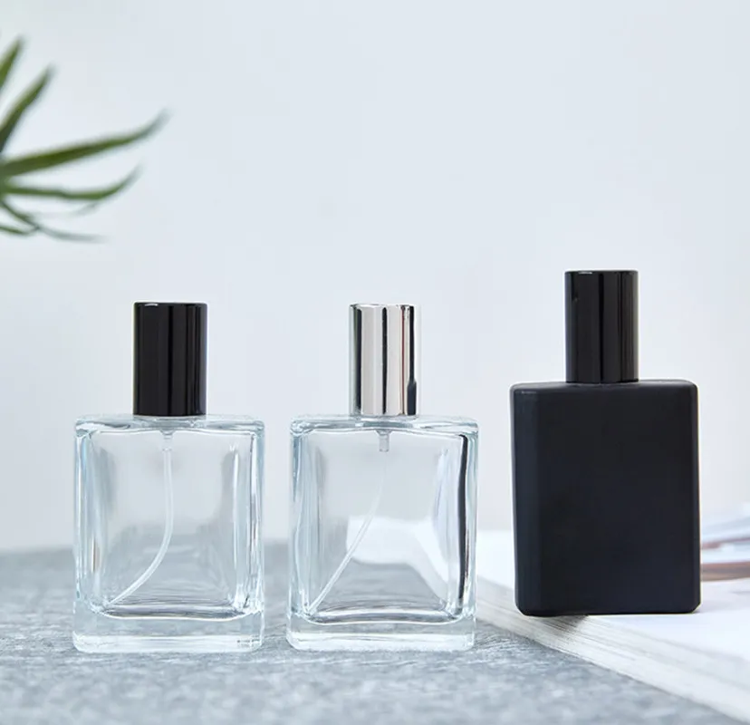 100 pièces 30 ml 50 ml haut de gamme portable bouteille de parfum en verre transparent avec bouchons noirs bouteilles vides vaporisateur