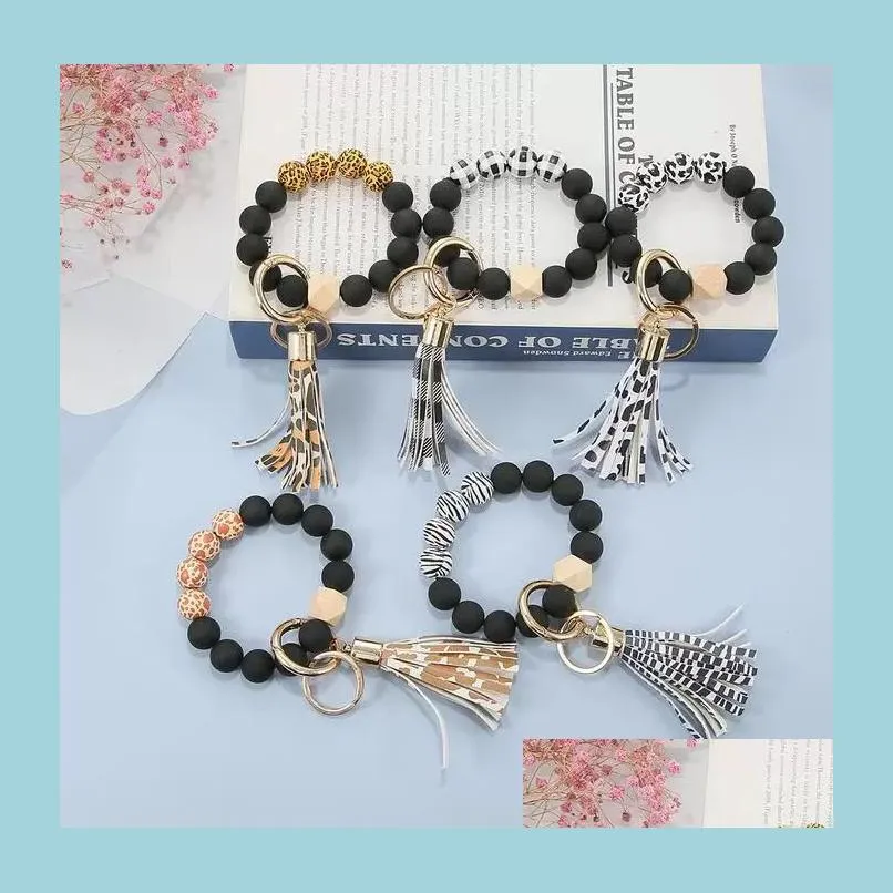 Keychains Lanyards Black Frosted Wood P￤rlor Armband Keychain Key Chain Pattern Tassel Pendant Armband Ring Keyring Wrist Stra Dhugh