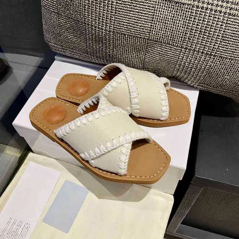 2023 Famosa marca Cross Cross Roman Slippers Designer feminino Moda genuína Sandálias planas para meninas Paris Ladies Classic Luxury Summer Casual Beach Shoes de caminhada