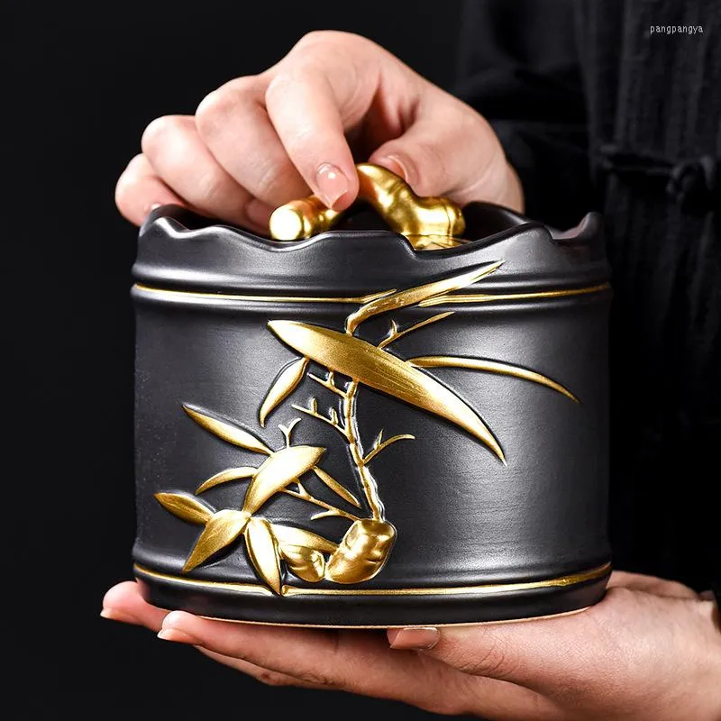 Бутылки для хранения золото покрыто винтажными керамическими чай