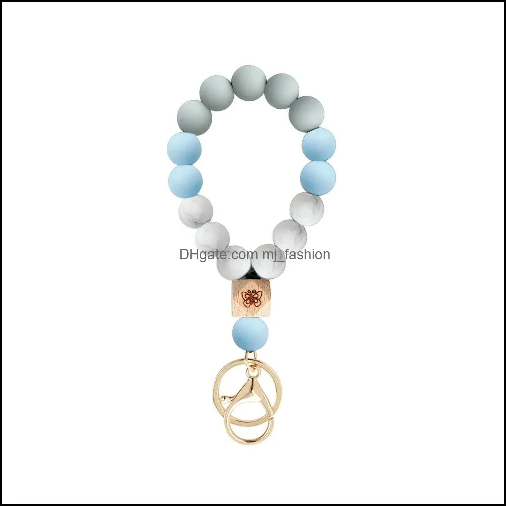 Porte-clés Sile Perle Strand Bracelet Key Rins Papillon Porte-clés En Bois Bracelet Bracelet Manchette Sac À Main Accroche Pour Femmes Hommes Mode Bijou Dh6Zs