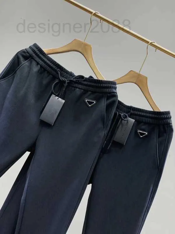 Męskie spodnie Designer 22ss Pants Men Europe Modne spodnie dla męskiej klasyczna siatka para frotte tkanina niestandardowa metalowa głowa sznurka odwrócona D65O