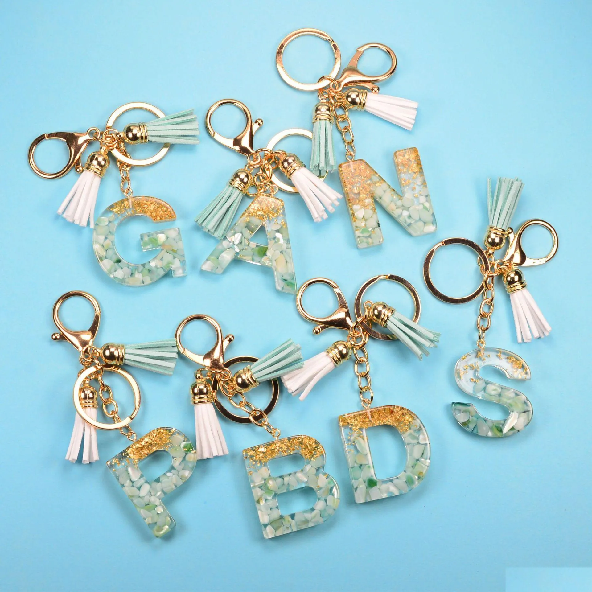Keychains Lanyards Fashion 26 Letters Resin Keychains For Women Gold Foil Bag Pendant Charms Handbag Accessories Tassel Key Rings Dhezn