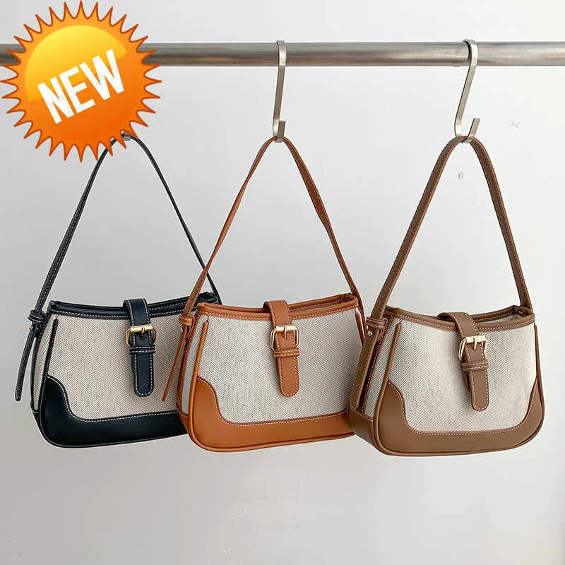 Bolsos de diseñador de lujo Nuevo nicho de mujer Bolso de hombro de lona ins empalme de moda mano arco triunfal axila sensación avanzada Ventas directas de fábrica