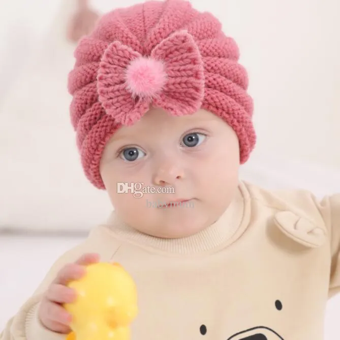 Commercio all'ingrosso cappello neonato neonato berretti beanie acrilico inverno cappelli lavorati a maglia ragazzi ragazze designer berretti teschio maglia bowknot pom poms berretti cofano