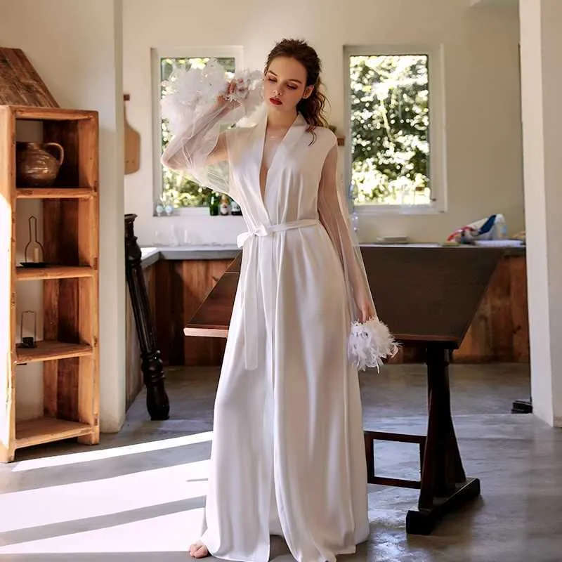 Young Woman in a White Silk Dressing Gown with Lace Cuffs by Dressing Room  Mirrors · Free Stock Photo