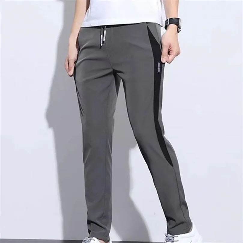 Мужские брюки мужчины брюки с высокой талией совпадают с тонкими эластичными драпирующими спортивными штанами 221007