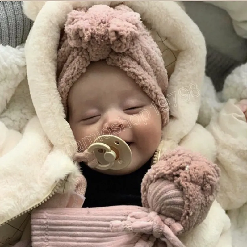 快適な温かい綿の幼児帽子ソリッドカラーボウノット新生児ビーニーキャップボウズヘッドウェアキッズヘアアクセサリー