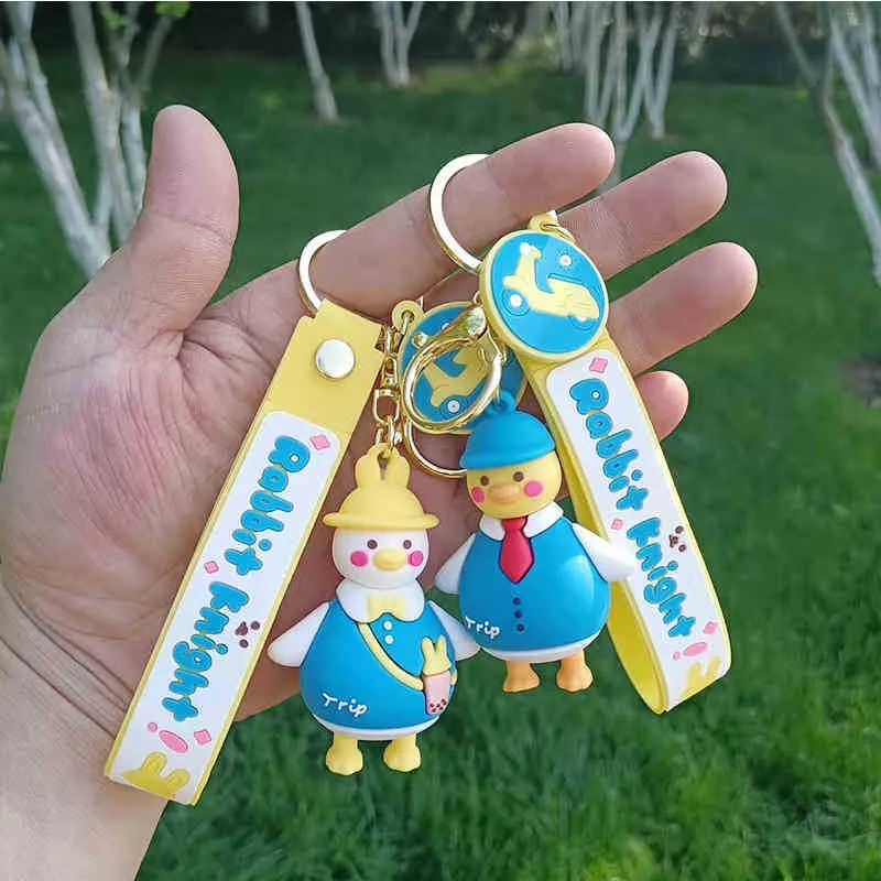 Porte-clés créatif drôle canard tordu clé dessin animé couple silicone poupée pendentif petit sac jaune