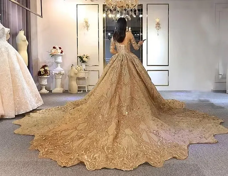 Luxurious Dubai Gold Wedding Dress with Shines, Gold Sequins, Long Train, Chapel Train - A-Line Cathedral Robe de Mariee with Half Sleeves (2023)