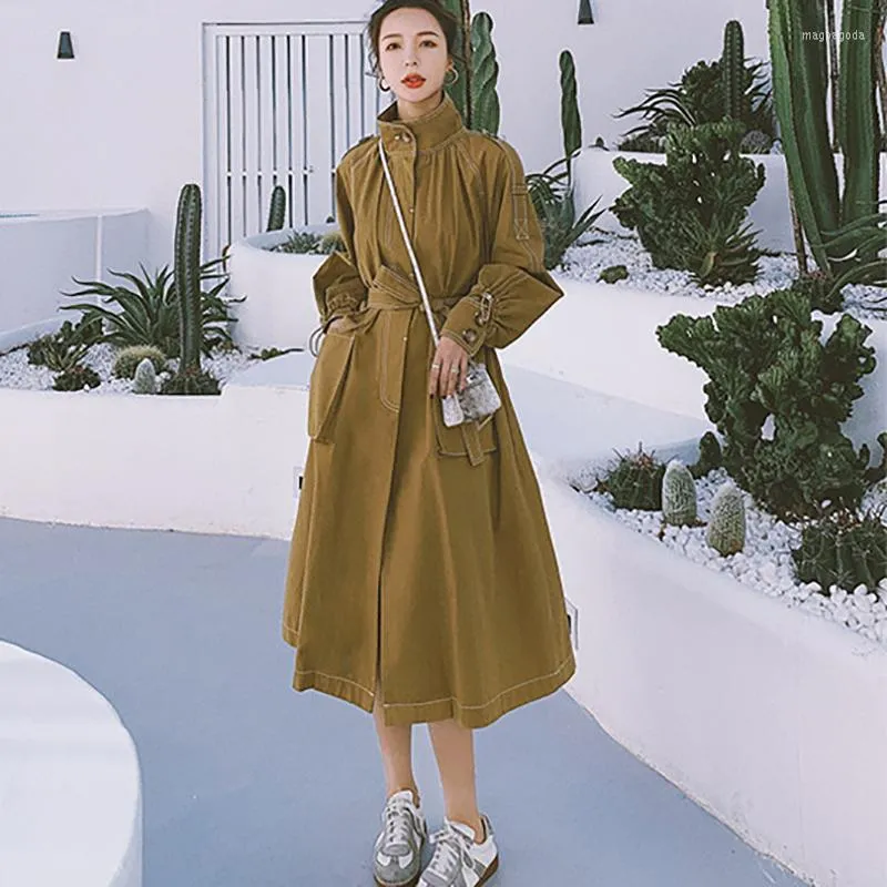 Women's Trench Coats Women's French Retro Dress Korean Version av midjan var tunnare i lång sektionsstativ krage Hepburn-stil