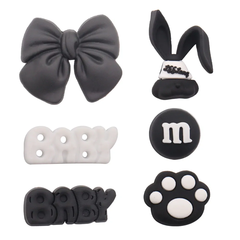 Wholesale 100Pcs PVC Black Footprints Chocolate Rabbit Baby Bow Sandals Buckle Shoe Charms Boys Girls Decorations For Button Clog Backpack