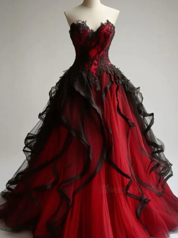 red lace vintage prom dress Gorgeous 1950's red lace and tulle prom dress! The strapless dress has a sweetheart neckline with a boned bodice for structure. There is gathered tulle at the bust with flowers in the
