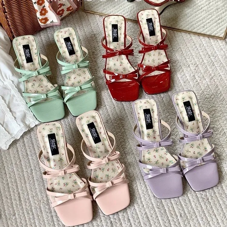Designer sandaler med hög klack och rosett för strand_voghion.com