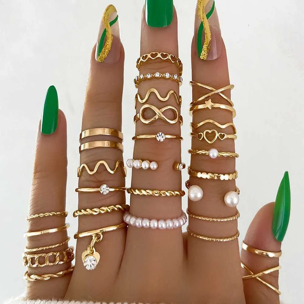 Set Of 28 Designer Rings With Pearl And Metal Cross Elements_voghion.com