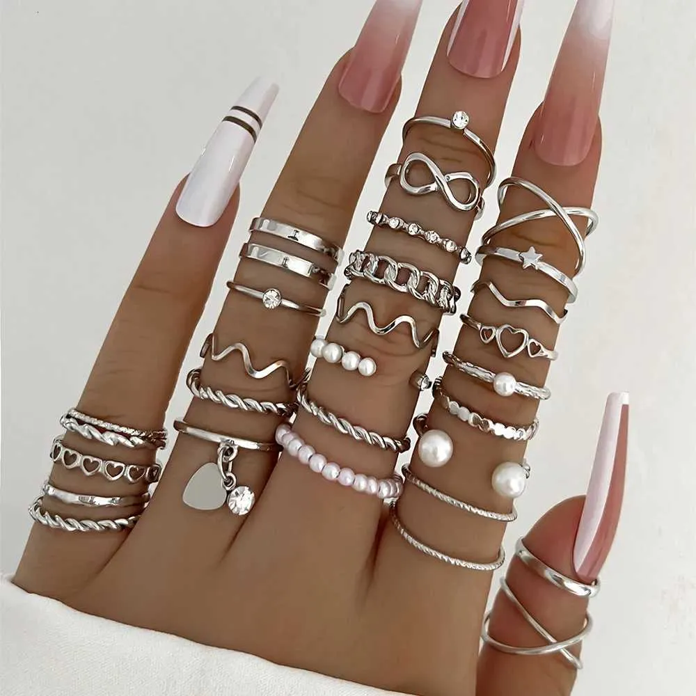 Set Of 28 Designer Rings With Pearl And Metal Cross Elements_voghion.com