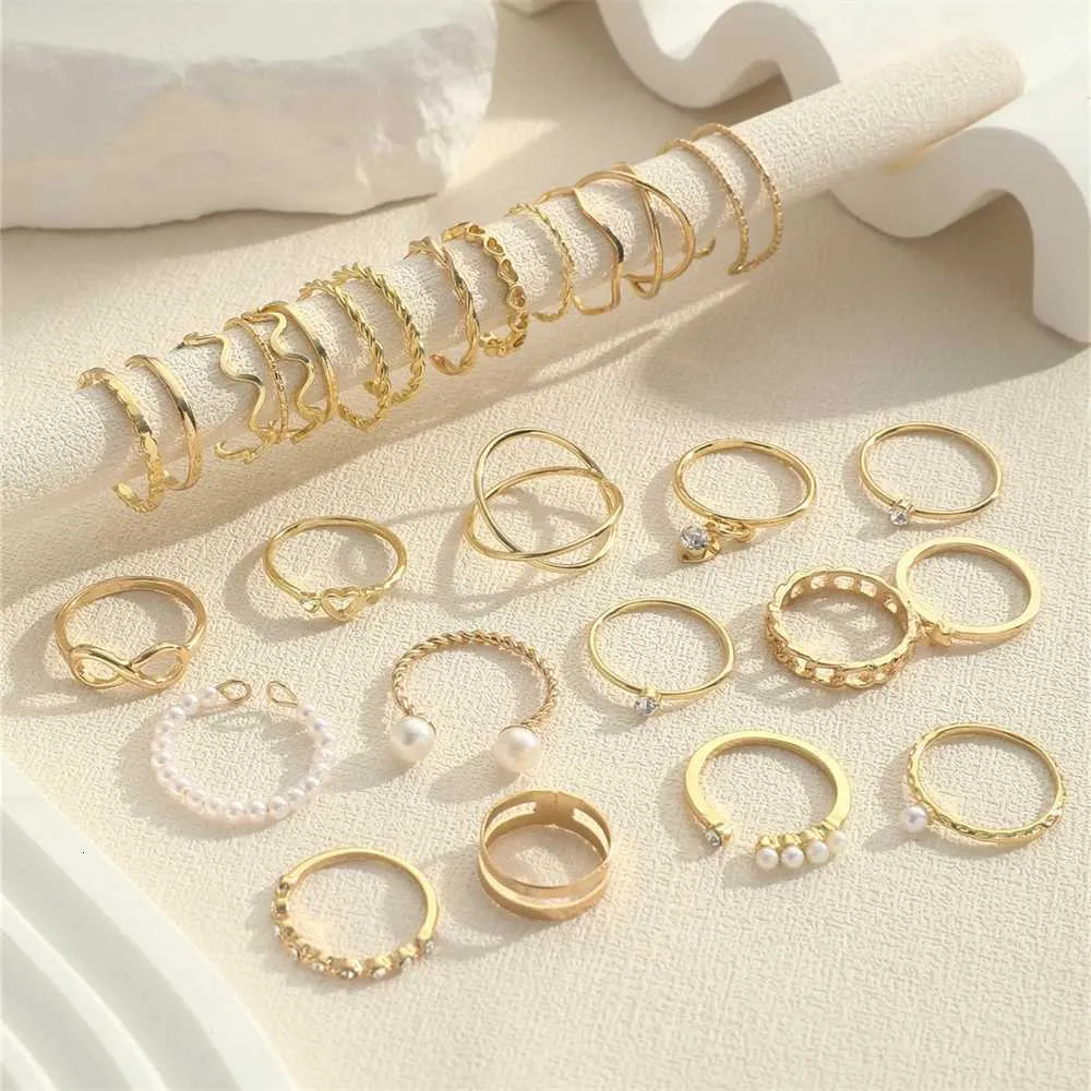 Set Of 28 Designer Rings With Pearl And Metal Cross Elements_voghion.com