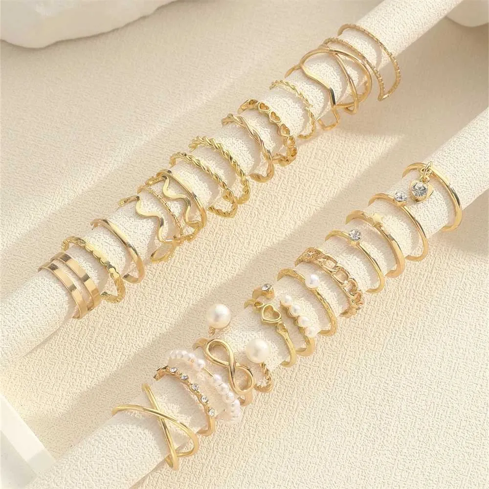Set Of 28 Designer Rings With Pearl And Metal Cross Elements_voghion.com