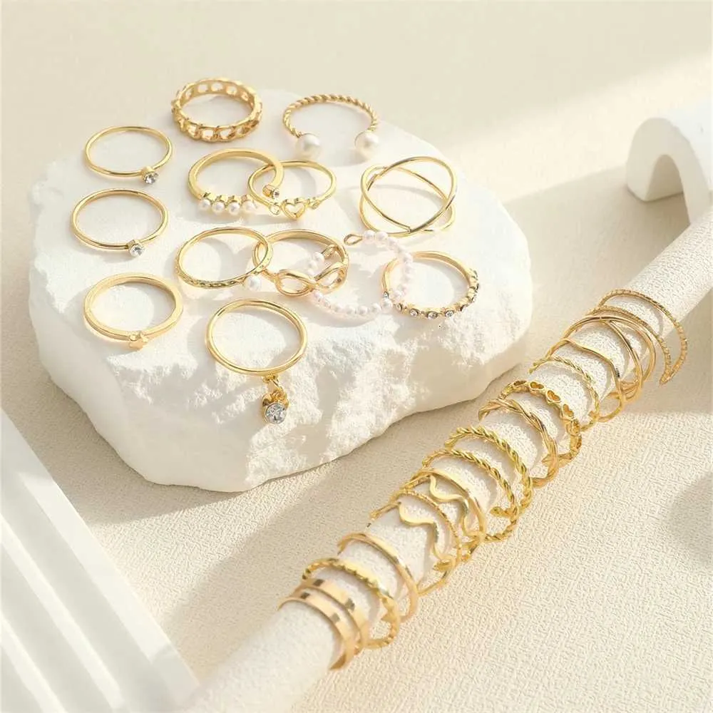 Set Of 28 Designer Rings With Pearl And Metal Cross Elements_voghion.com