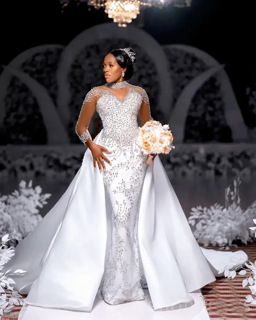 2025 African Mermaid wedding dress overskirt with Heavy Crystals, Beads, and Removable Satin Skirt - Full Sleeves Bridal Gown 2025 African Mermaid wedding dress overskirt with Heavy Crystals, Beads, and Removable Satin Skirt - Full Sleeves Bridal Gown
