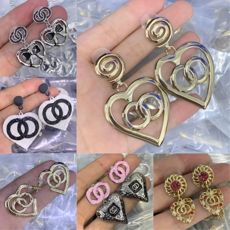 Zilveren oorring met hanger hart met zirkonia voor dames | -NL